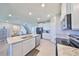 Stylish kitchen with stainless steel appliances, granite countertops, a central island, and bright, open layout at 1407 Tropical Oasis Ave, Plant City, FL 33565