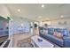 Open-concept living room with modern furnishings, neutral decor, and seamless flow into the kitchen at 1407 Tropical Oasis Ave, Plant City, FL 33565