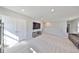 Bright, open upstairs living area with neutral carpet and a media center at 1407 Tropical Oasis Ave, Plant City, FL 33565