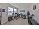 Office space with modern desk, dual monitors, and plentiful natural light at 1407 Tropical Oasis Ave, Plant City, FL 33565