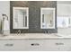 Bathroom featuring dual sinks, marble countertop, mosaic tile backsplash, and modern fixtures at 14834 Crown Dr, Largo, FL 33774