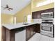 Kitchen featuring stainless steel appliances, island, and light countertops at 1521 Ledgestone Dr, Brandon, FL 33511