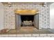 Stone fireplace with ornate brass doors at 1707 Sunnyhills Dr, Brandon, FL 33510