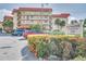 Beautiful condominium building with lush landscaping and visible signage at 17580 Gulf Blvd # 302, Redington Shores, FL 33708