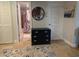 Hallway with bathroom entrance, blue drawer, and rug, offering convenient access to various rooms at 1905 Oyster Catcher Ln # 911, Clearwater, FL 33762