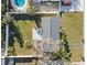 Aerial view of property with pool, driveway, and yard at 2003 6Th Sw Pl, Largo, FL 33770