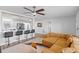 Open-concept living space showcasing the modern design, bar seating, and seamless flow into the adjacent kitchen at 2003 6Th Sw Pl, Largo, FL 33770