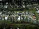 Aerial view of the neighborhood showcasing canal-front homes and mature landscaping at 2215 River Ridge Dr, Sarasota, FL 34239
