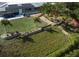 Spacious backyard featuring a well-maintained lawn, terraced garden, waterfront, and outdoor entertaining space at 2215 River Ridge Dr, Sarasota, FL 34239
