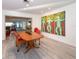 Dining room featuring modern art and a wooden table with red chairs at 2215 River Ridge Dr, Sarasota, FL 34239