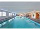 Spacious indoor pool with an adjacent lounging and dining space, perfect for year-round enjoyment at 2215 River Ridge Dr, Sarasota, FL 34239