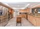 Spacious kitchen featuring stainless steel appliances, a center island, and granite countertops at 2215 River Ridge Dr, Sarasota, FL 34239