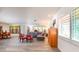 Open concept living room featuring wood-look floors, a large grey sectional, and modern art at 2215 River Ridge Dr, Sarasota, FL 34239