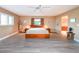 Large main bedroom featuring wood-look floors and an en-suite bathroom at 2215 River Ridge Dr, Sarasota, FL 34239