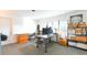 Functional office space featuring ample natural light, neutral carpet, and multiple work and storage areas at 2215 River Ridge Dr, Sarasota, FL 34239