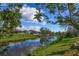 Serene water view showcasing the tranquil canal and lush greenery surrounding the property at 2215 River Ridge Dr, Sarasota, FL 34239