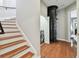 Hallway with a staircase, an in-home elevator and a laundry room at 2307 Victoria Gardens Ln, Tampa, FL 33609