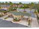 Aerial view of the community entrance, showcasing beautiful landscaping and gated access at 23331 Abercorn Ln, Land O Lakes, FL 34639