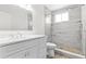 Remodeled bathroom with modern vanity and glass enclosed tile shower at 2404 Florentine Way # 40, Clearwater, FL 33763