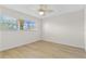 Bedroom featuring a ceiling fan, bright window, and neutral walls at 2404 Florentine Way # 40, Clearwater, FL 33763