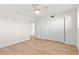 Bright bedroom with ceiling fan, closet and light wood flooring at 2404 Florentine Way # 40, Clearwater, FL 33763