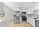 Modern kitchen featuring stainless steel appliances, white cabinets, and lots of natural light at 2404 Florentine Way # 40, Clearwater, FL 33763