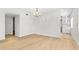 Well-lit living room featuring hardwood floors and an open concept design at 2404 Florentine Way # 40, Clearwater, FL 33763