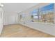 Bright living room featuring wood floors, natural light from windows, and a closet at 2404 Florentine Way # 40, Clearwater, FL 33763