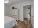 Bedroom view featuring hardwood floors, a ceiling fan, and classic white furniture at 2430 Florentine Way # 44, Clearwater, FL 33763