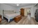 Comfortable bedroom featuring hardwood floors, a ceiling fan, and classic wood furniture at 2430 Florentine Way # 44, Clearwater, FL 33763