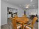 Dining area featuring a wooden table with chairs, adjacent to the kitchen and other living areas at 2430 Florentine Way # 44, Clearwater, FL 33763