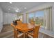 Bright dining area with a round table and large windows offering outdoor views at 2430 Florentine Way # 44, Clearwater, FL 33763