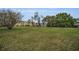 Expansive grassy common area and view of the complex buildings; well maintained grounds at 2430 Florentine Way # 44, Clearwater, FL 33763