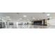 Spacious hall with stage, lighting, and ample open floor, enhanced by sleek flooring and decor at 2430 Florentine Way # 44, Clearwater, FL 33763