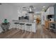 Bright kitchen features stainless steel appliances, stylish lighting and bar seating for casual dining at 2430 Florentine Way # 44, Clearwater, FL 33763
