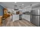 Spacious kitchen with stainless steel appliances and an open layout flowing into the living area at 2430 Florentine Way # 44, Clearwater, FL 33763
