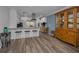 Open-concept kitchen with a breakfast bar, pendant lighting, and stainless steel appliances at 2430 Florentine Way # 44, Clearwater, FL 33763