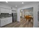 Kitchen featuring stainless steel refrigerator, stone backsplash and an adjacent dining area at 2430 Florentine Way # 44, Clearwater, FL 33763