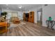 Bright living room featuring modern wood-look floors, neutral walls, and an open layout at 2430 Florentine Way # 44, Clearwater, FL 33763