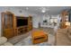 Open-concept living area with a breakfast bar and wood-look flooring at 2430 Florentine Way # 44, Clearwater, FL 33763