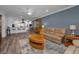 Open-concept living space with a breakfast bar and neutral color palette at 2430 Florentine Way # 44, Clearwater, FL 33763