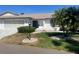 Home exterior featuring a well-manicured front lawn and tidy landscaping at 2504 Lonigan Pl # 2504, Sun City Center, FL 33573