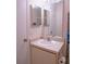 Bathroom featuring a single sink vanity with a large mirror and lighting at 3001 58Th S Ave # 312, St Petersburg, FL 33712