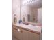 Well-lit bathroom featuring a wide mirror, a vanity with generous countertop space, and neutral color scheme at 3001 58Th S Ave # 312, St Petersburg, FL 33712