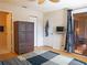 Bedroom with a sliding glass door to a patio and a wooden dresser at 3001 58Th S Ave # 312, St Petersburg, FL 33712