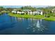 Beautiful condo community overlooking a scenic lake with a fountain and lush landscaping at 3001 58Th S Ave # 312, St Petersburg, FL 33712