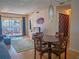 Inviting living room features dining area, balcony, and comfortable seating, perfect for relaxation at 3001 58Th S Ave # 312, St Petersburg, FL 33712
