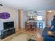 Warm and inviting living room features laminate flooring, open layout, and a cozy dining area at 3001 58Th S Ave # 312, St Petersburg, FL 33712