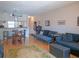 Inviting open-concept living space features a dining area and durable laminate flooring throughout at 3001 58Th S Ave # 312, St Petersburg, FL 33712