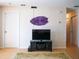 Cozy living room featuring a television set on a stand with wood flooring and neutral walls at 3001 58Th S Ave # 312, St Petersburg, FL 33712